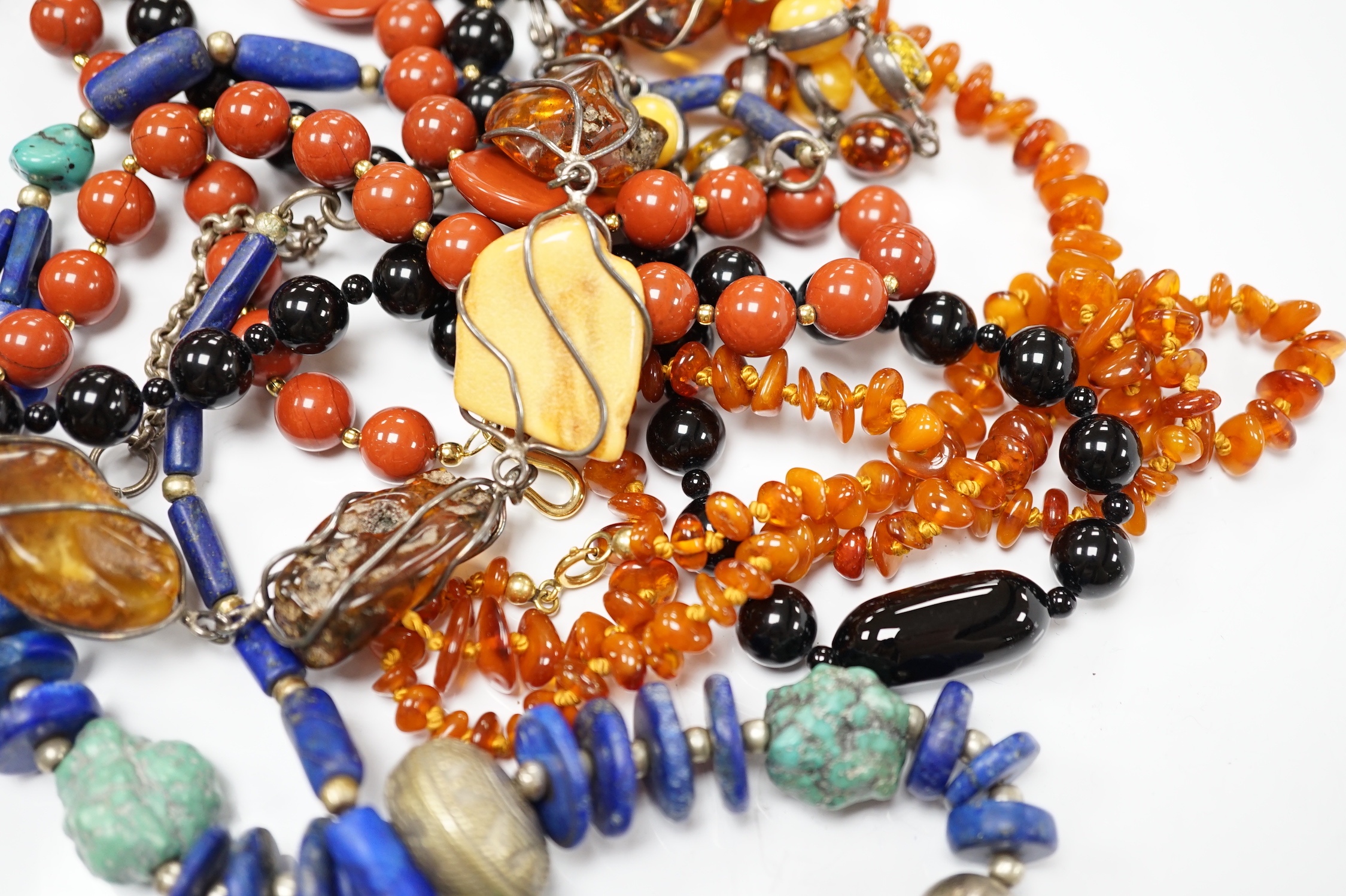 Kai Yin Lo- A twin strand black onyx and jasper bead necklace, 60cm and pair of matching drop earrings and a lapis lazuli and turquoise matrix necklace.